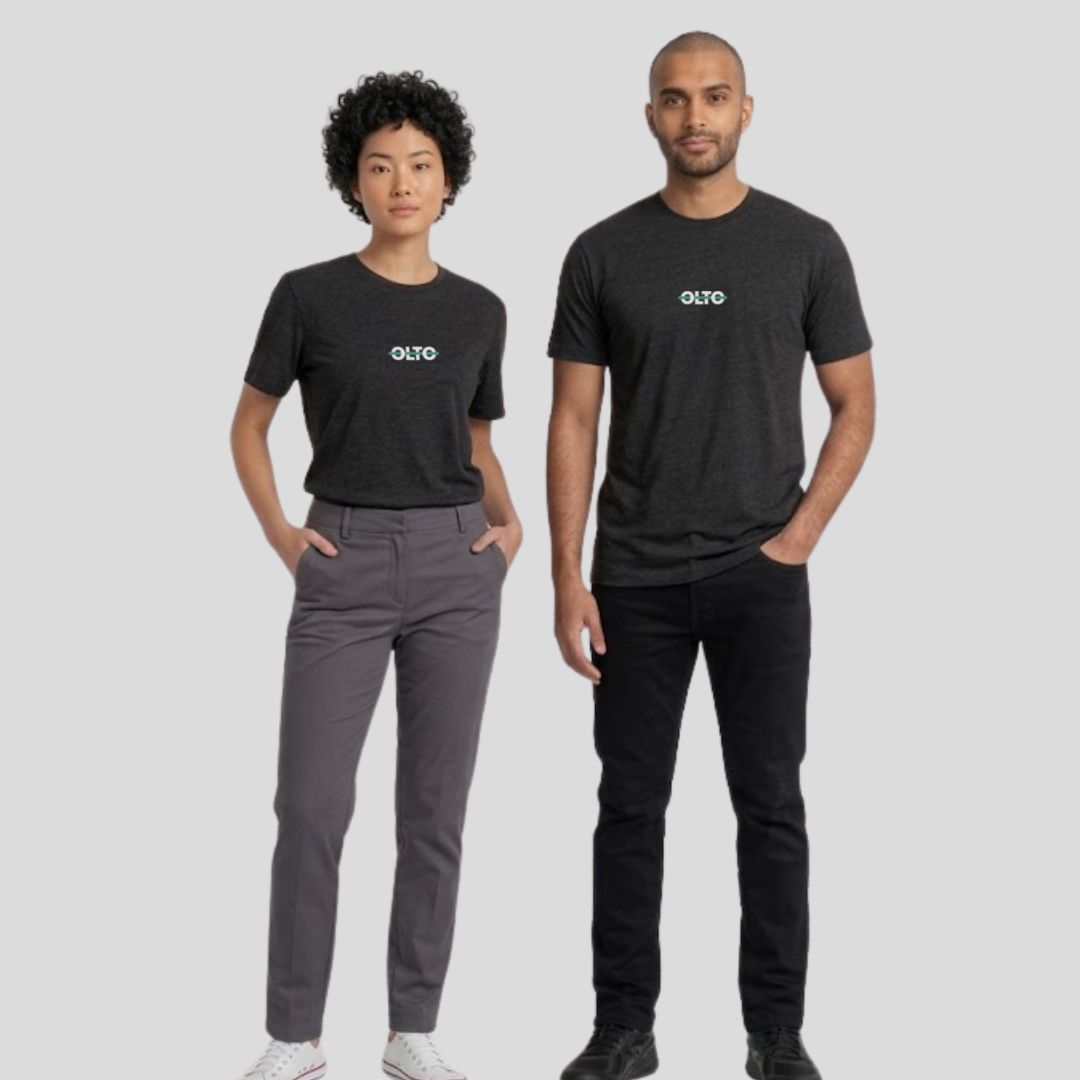 Male and female models wearing the OLTO Relaxed T-Shirt in Black to demonstrate the versatile unisex relaxed fit and streetwear styling.