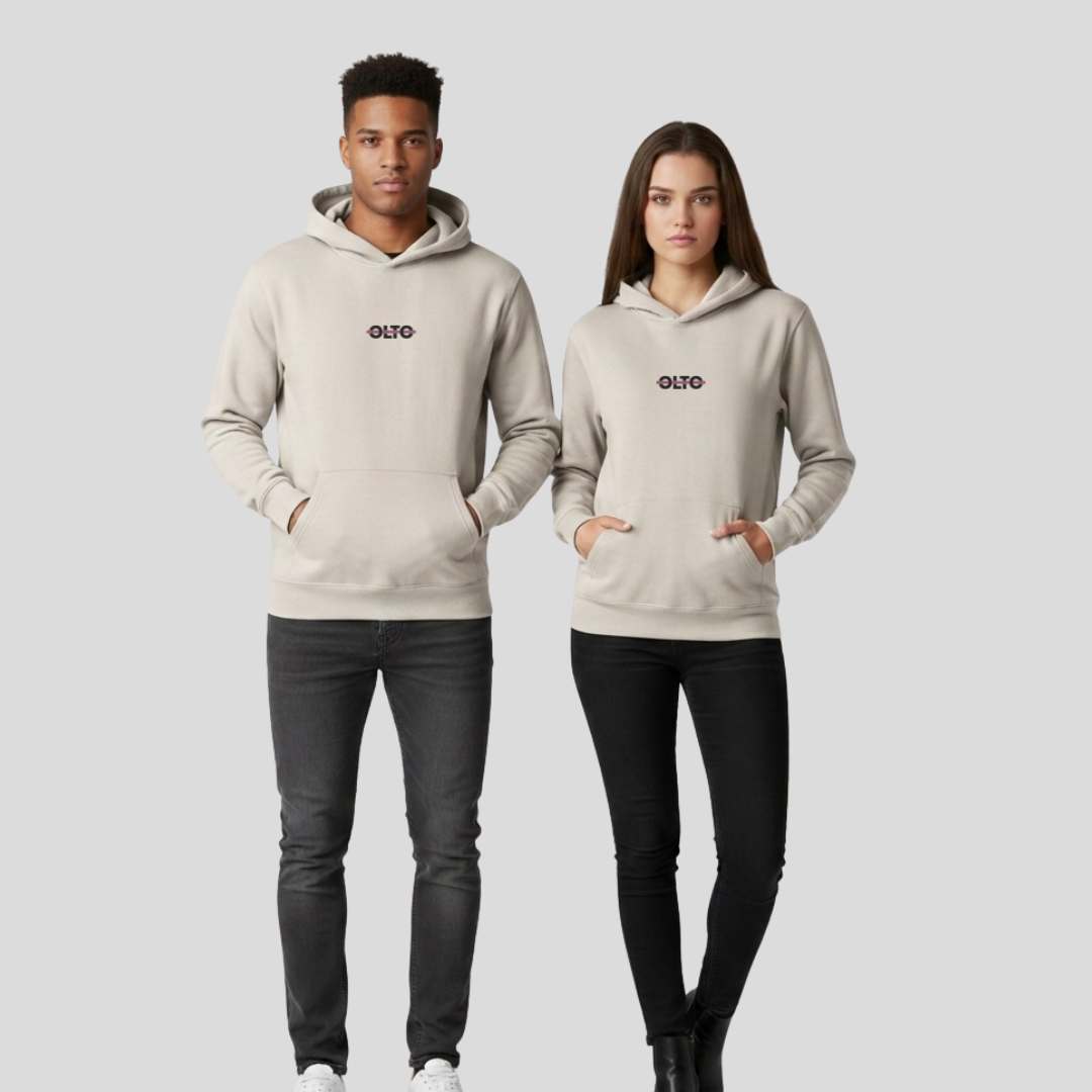 Male and female models wearing the OLTO Relaxed Hoodie in Bone to demonstrate the versatile unisex relaxed fit and streetwear styling.