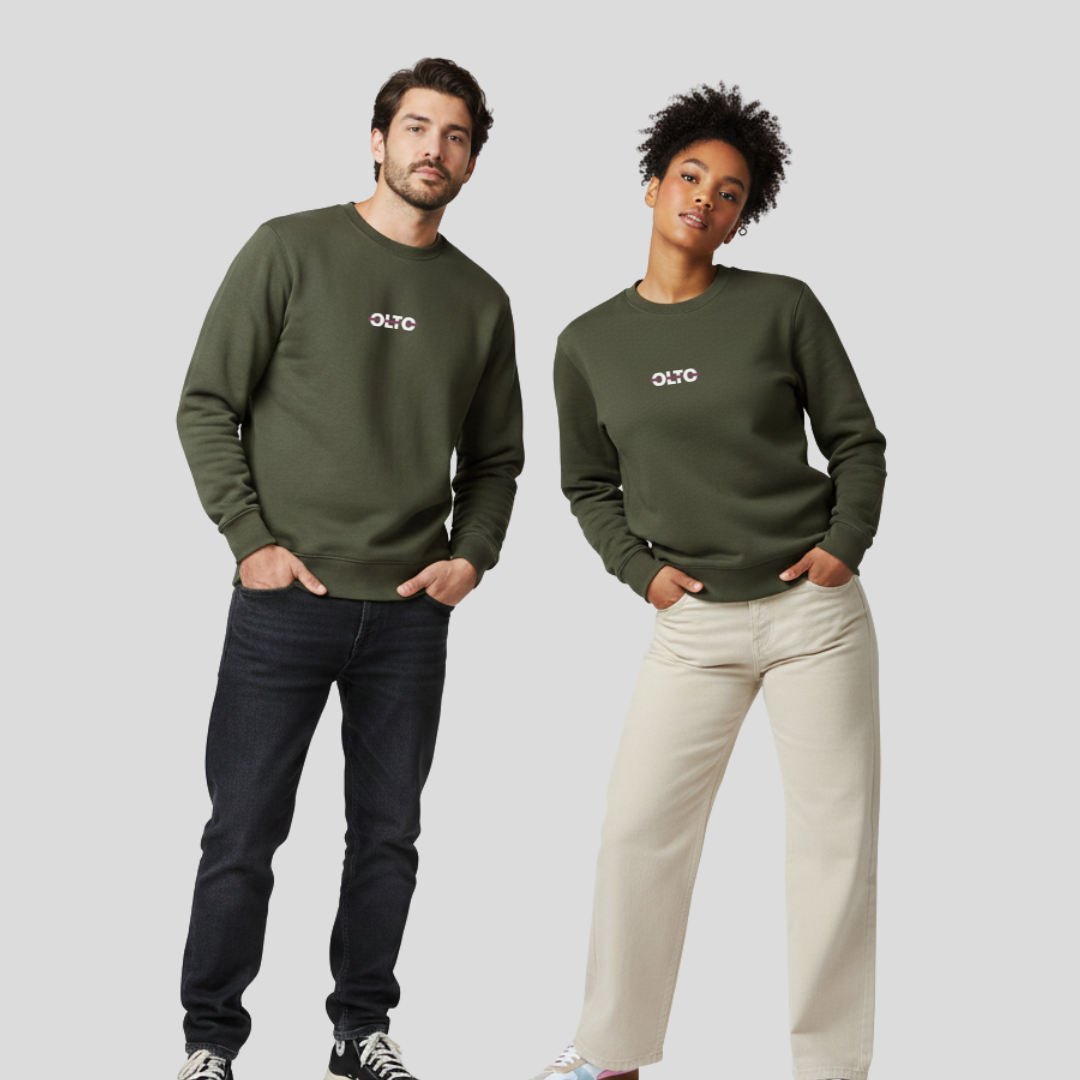Male and female models wearing the OLTO Relaxed Sweater in Cypress to demonstrate the versatile unisex relaxed fit and streetwear styling.