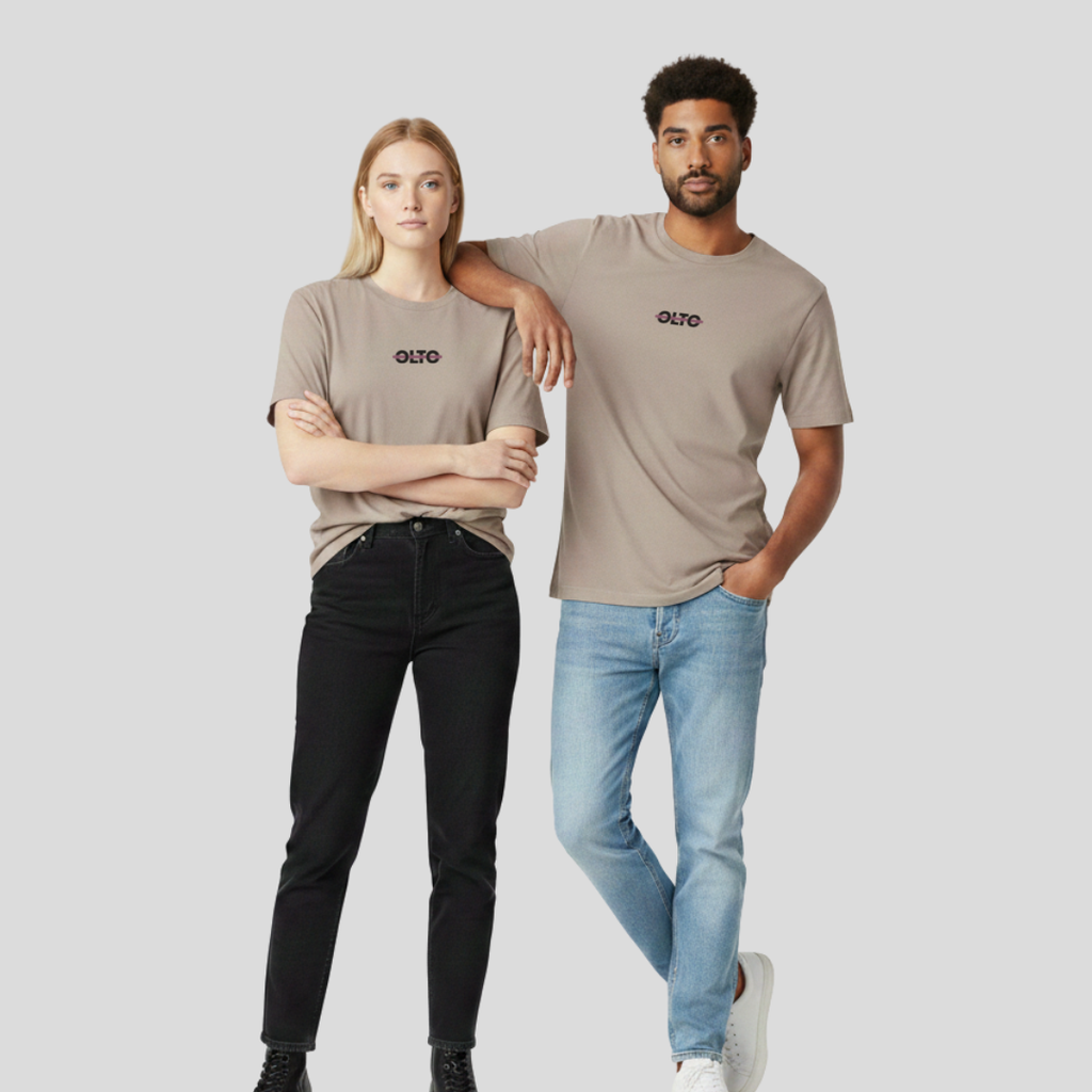 Male and female models wearing the OLTO Relaxed T-Shirt in Faded Mushroom to demonstrate the versatile unisex relaxed fit and streetwear styling.