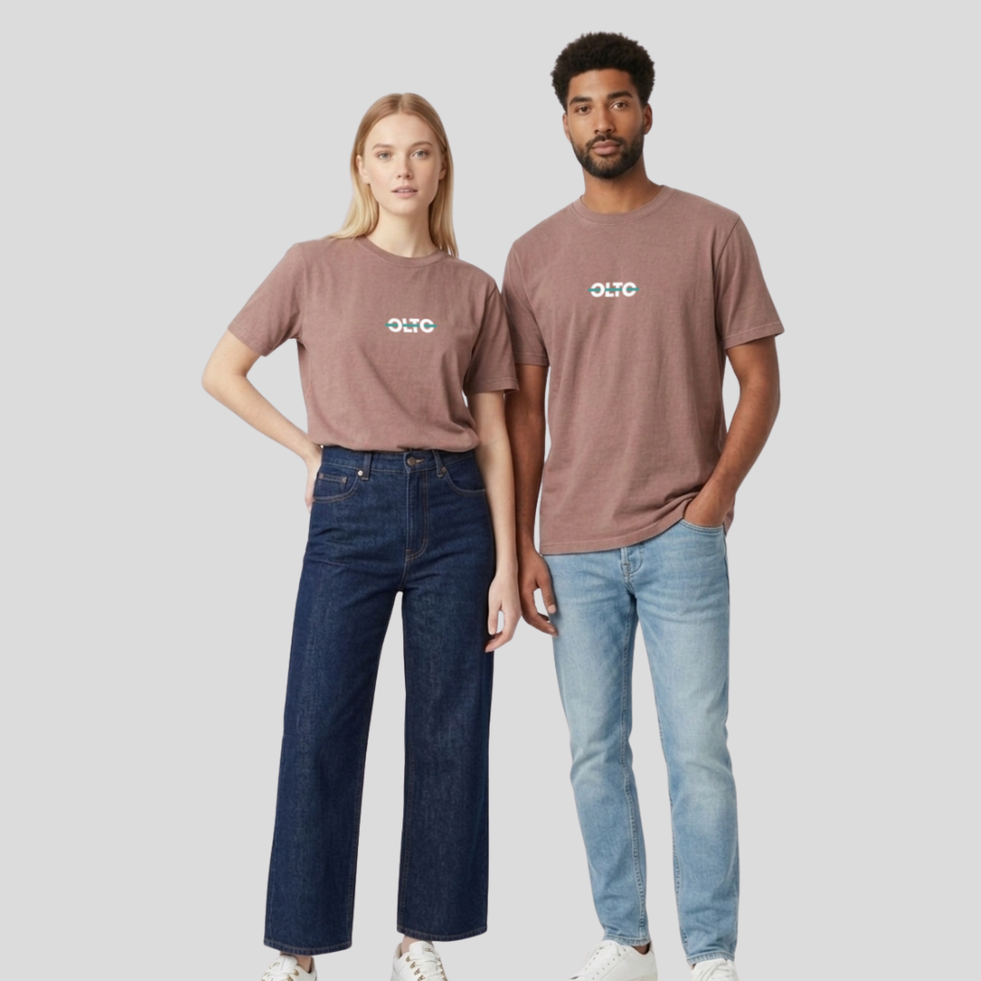 Male and female models wearing the OLTO Relaxed T-Shirt in Faded Pink to demonstrate the versatile unisex relaxed fit and streetwear styling.
