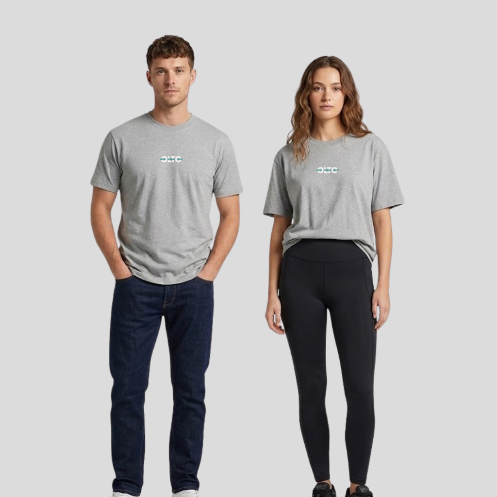 Male and female models wearing the OLTO Relaxed T-Shirt in Grey Marl to demonstrate the versatile unisex relaxed fit and streetwear styling.