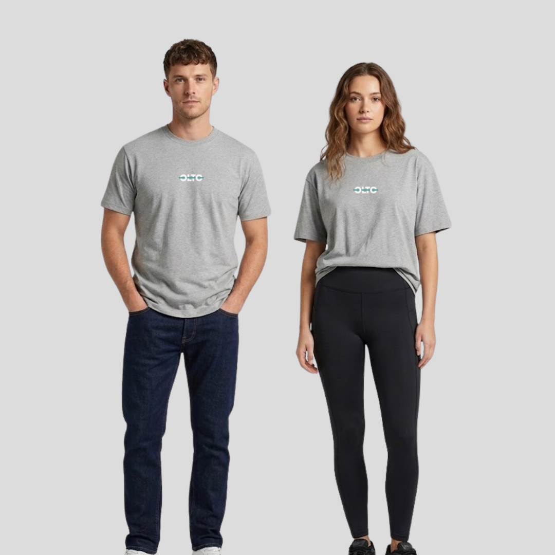 Male and female models wearing the OLTO Relaxed T-Shirt in Grey Marl to demonstrate the versatile unisex relaxed fit and streetwear styling.