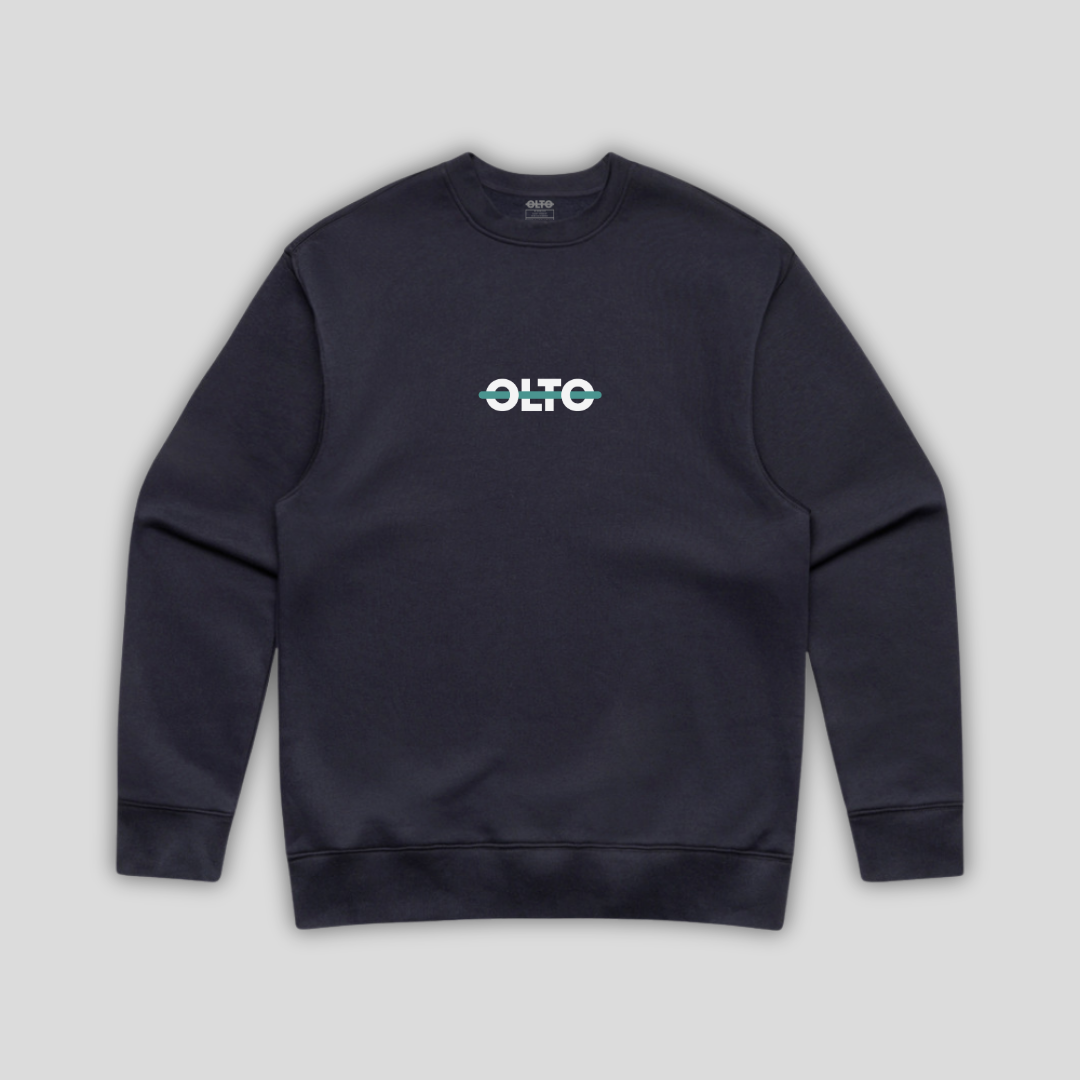 Front view flat lay of OLTO Sweater in Ink Blue showing the signature ColourBolt chest logo and premium heavyweight fabric texture.