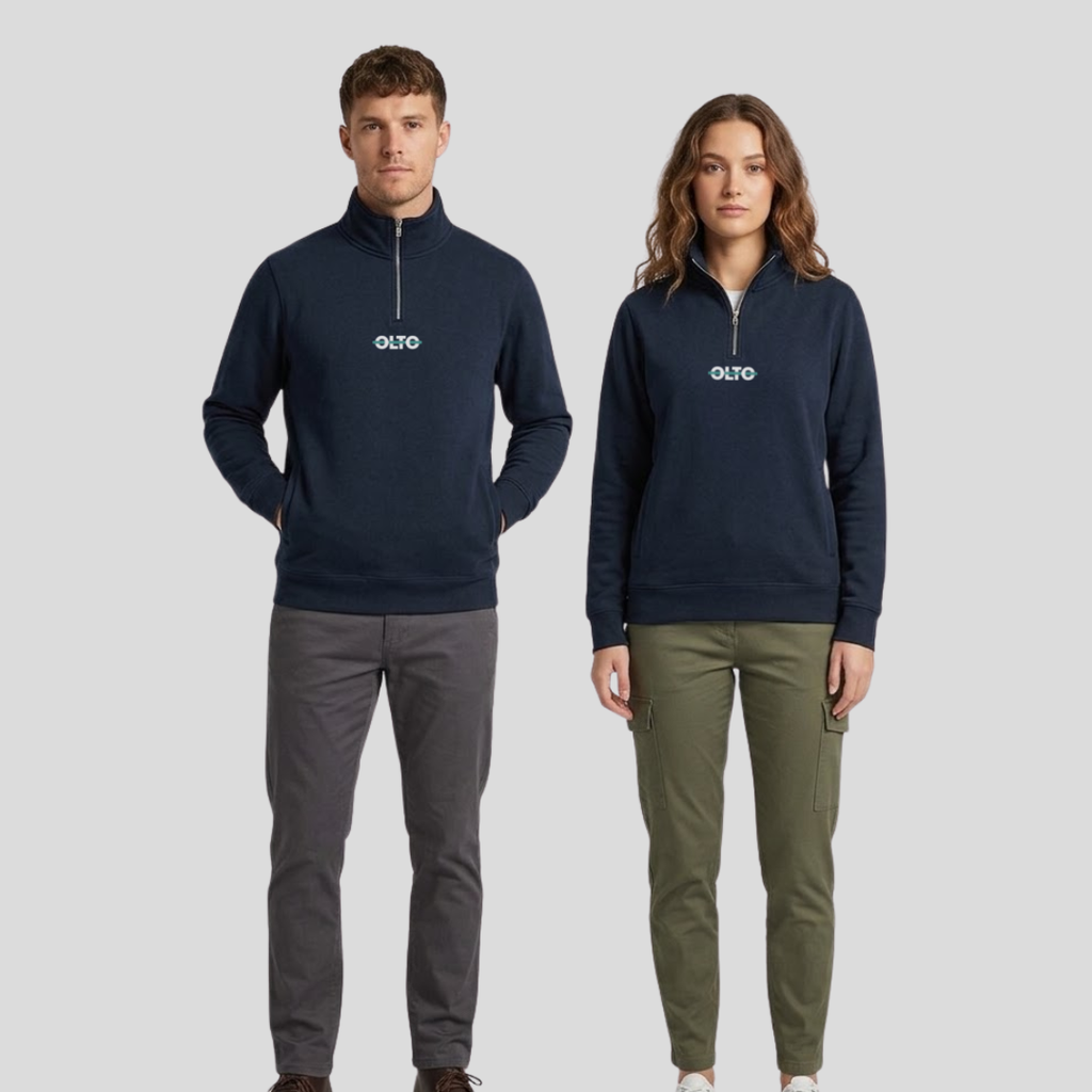 Male and female models wearing the OLTO Half Zip in Navy to demonstrate the versatile unisex relaxed fit and streetwear styling.