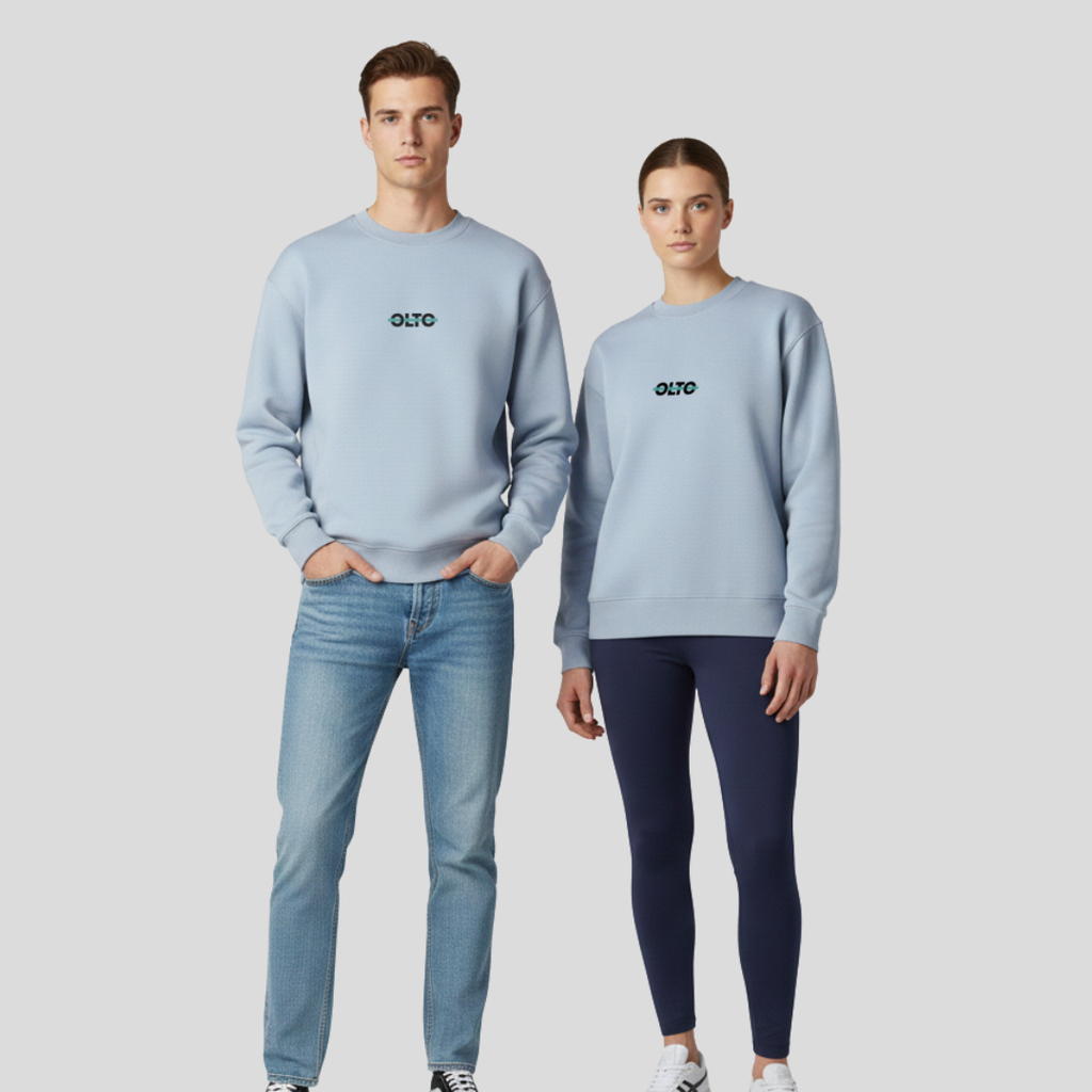 Male and female models wearing the OLTO Relaxed Sweater in Powder to demonstrate the versatile unisex relaxed fit and streetwear styling.