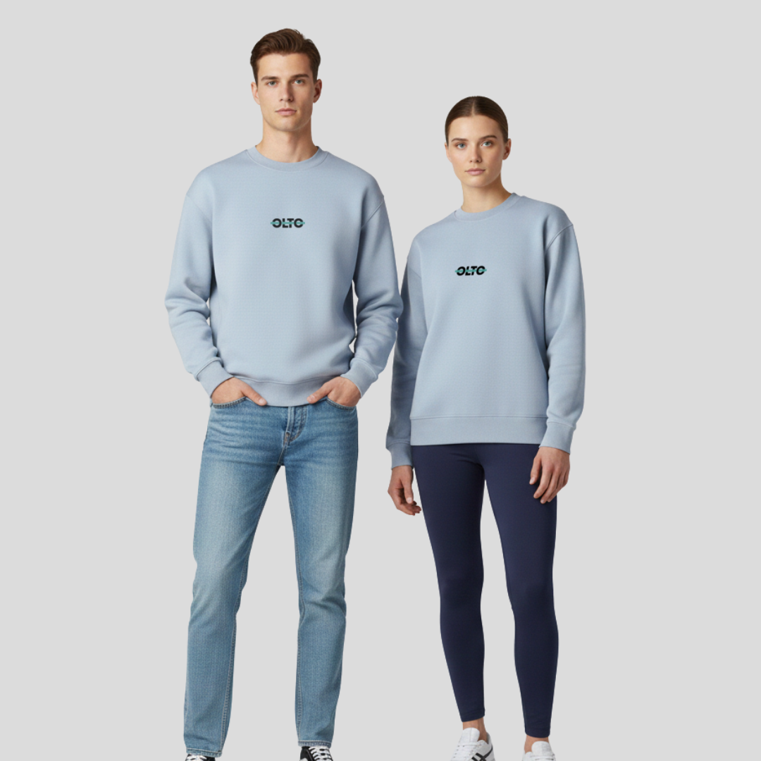 Male and female models wearing the OLTO Relaxed Sweater in Powder to demonstrate the versatile unisex relaxed fit and streetwear styling.