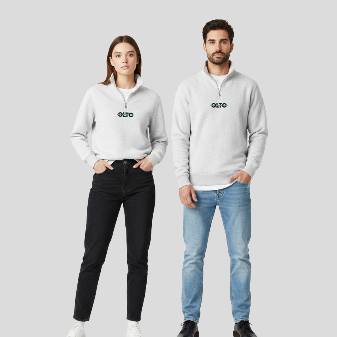 Male and female models wearing the OLTO Half Zip in White Heather to demonstrate the versatile unisex relaxed fit and streetwear styling.